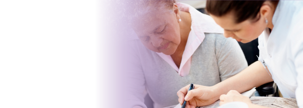 the caregiver accompanied the elderly woman on writing