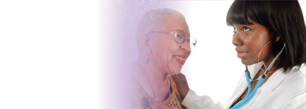 an elderly woman and an african caregiver